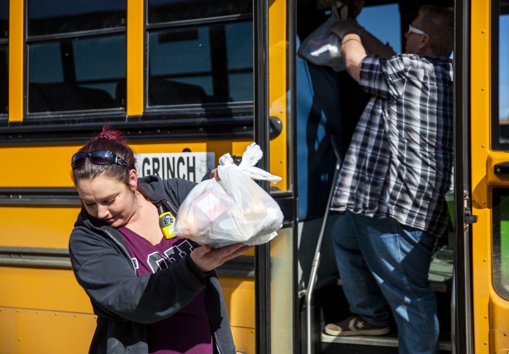 Bus drivers deliver food to students